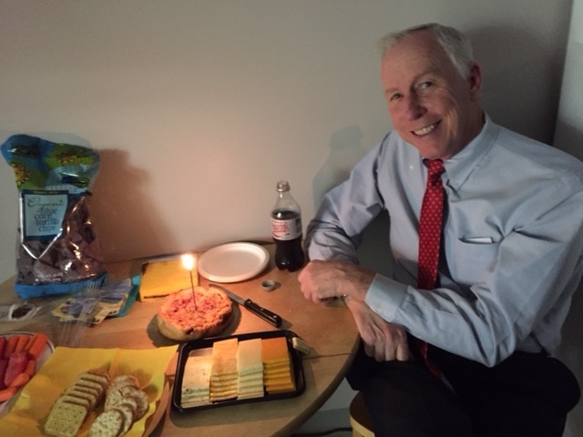 Photo of Dr Wethe enjoying his birthday cake